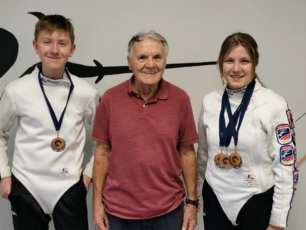 Bull City Fencing Tournament Victory - Gabriel and Gianna Marisi bring home 4 medals Gabriel Marisi and Gianna Marisi proudly displaying their 4 medals from the Bull City Fencing Tournament, photographed inside Salle D'Armes Bosco fencing center in Madison, Alabama