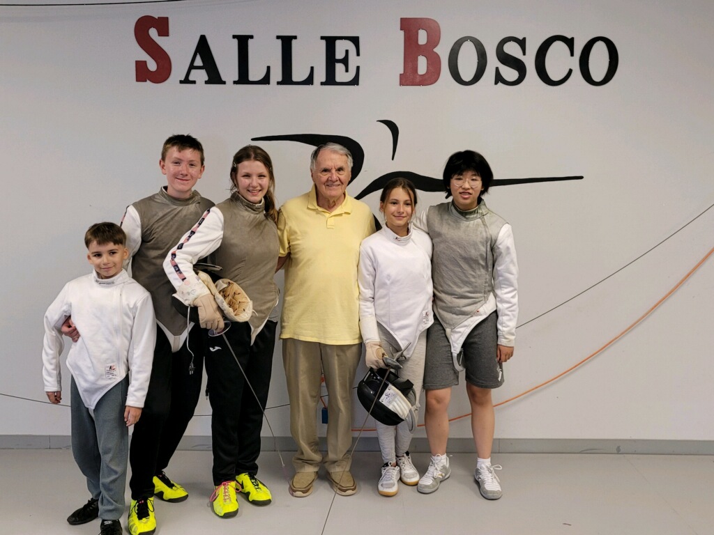 Active Competitors After Intensive Training - Dedicated foil fencers at Salle Bosco Group photo of active foil competitors at Salle D'Armes Bosco after completing an intensive training session in Madison, Alabama